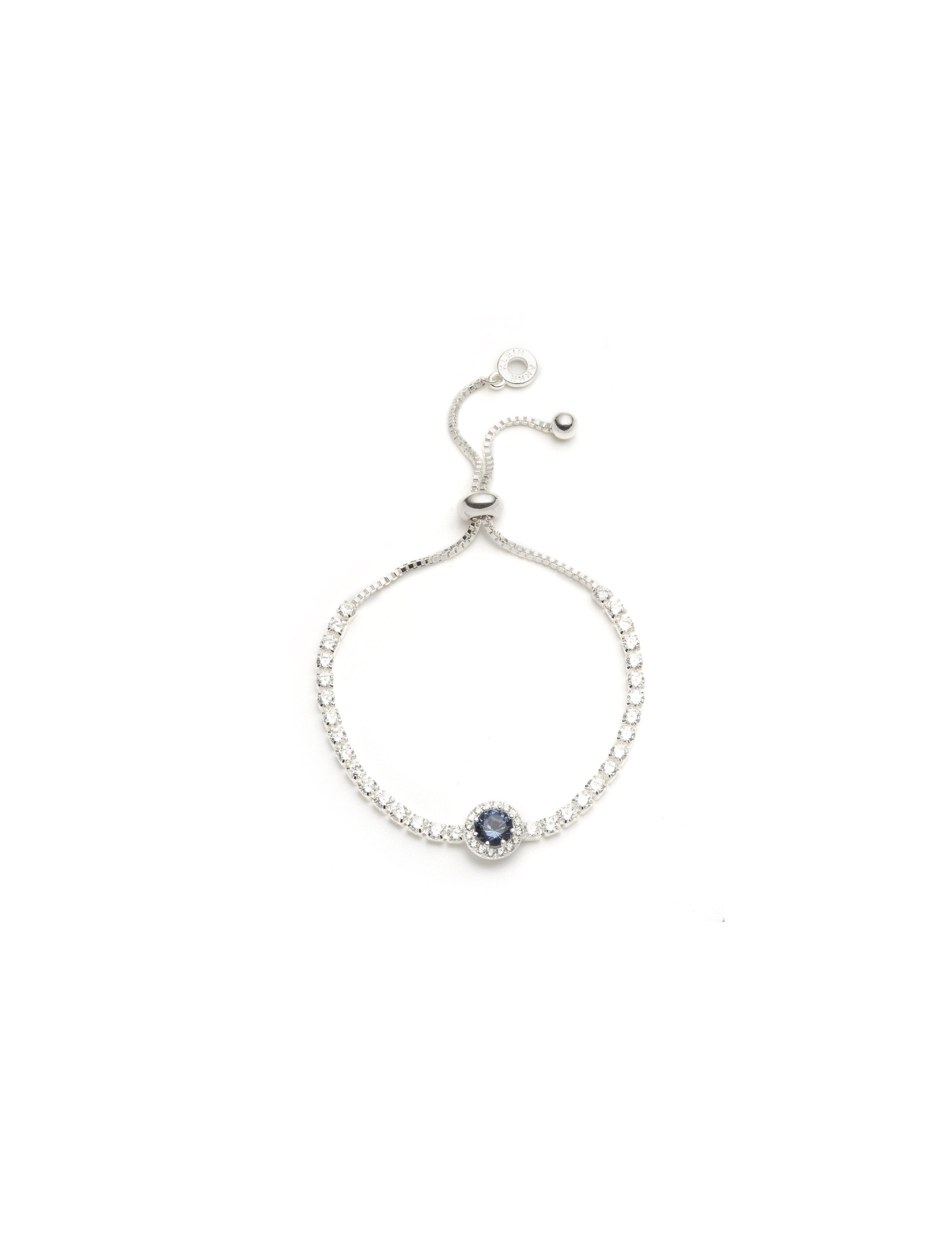 silver tone halo center stone slider bracelet with denim blue stone