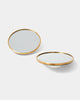 Two round mirrors with brass frame and half sphere white ceramic base.