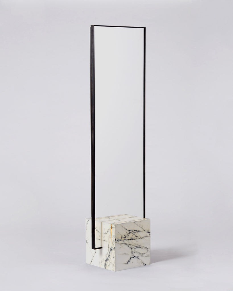 Standing mirror with white marble cube base and rectangular blackened steel mirror frame