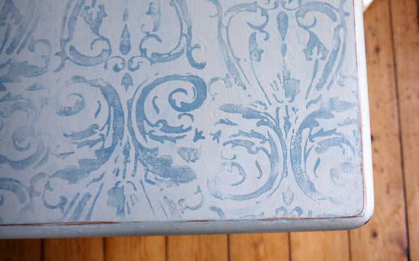 Classic farmhouse dining table updated in Annabell Duke chalk paint in blue and cream with gorgeous decorative design on the top