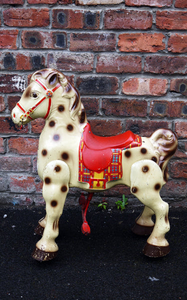 vintage toy horse on wheels