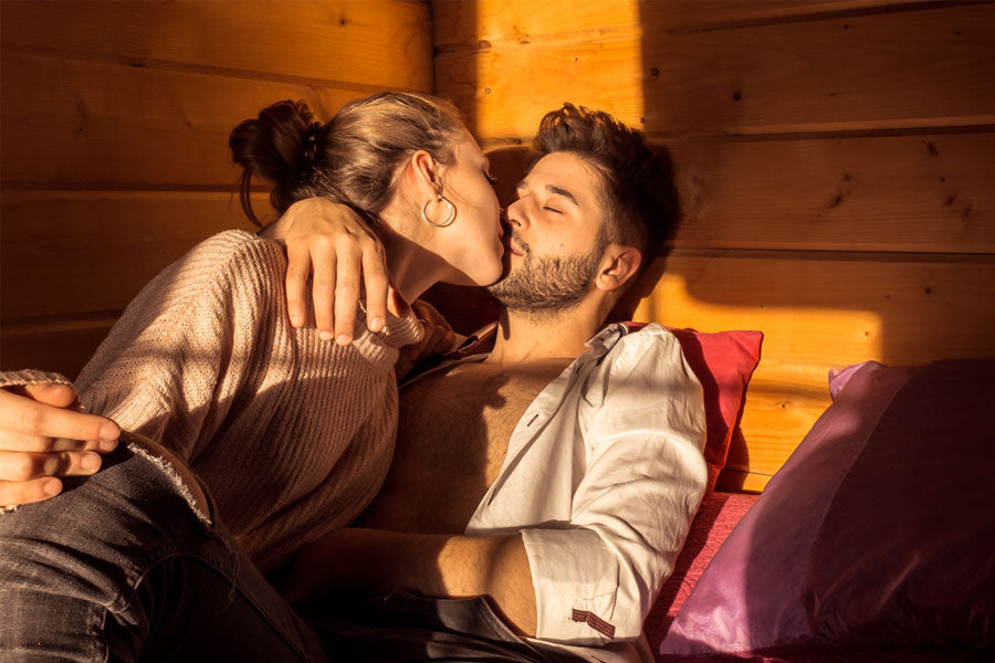 man and woman kissing in bed, cabin sex story 