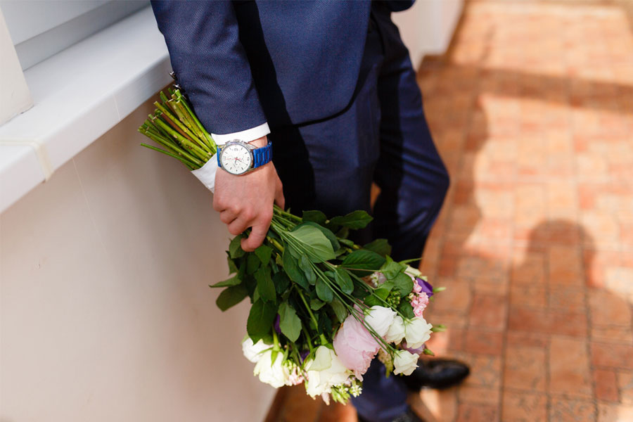 Man in suit with flowers for date