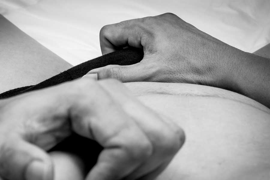 man grabbing his penis through underwear, clutching chest, caught masturbating erotic story