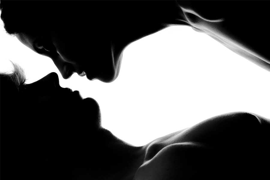 Man and woman silhouette kissing, older woman erotic story