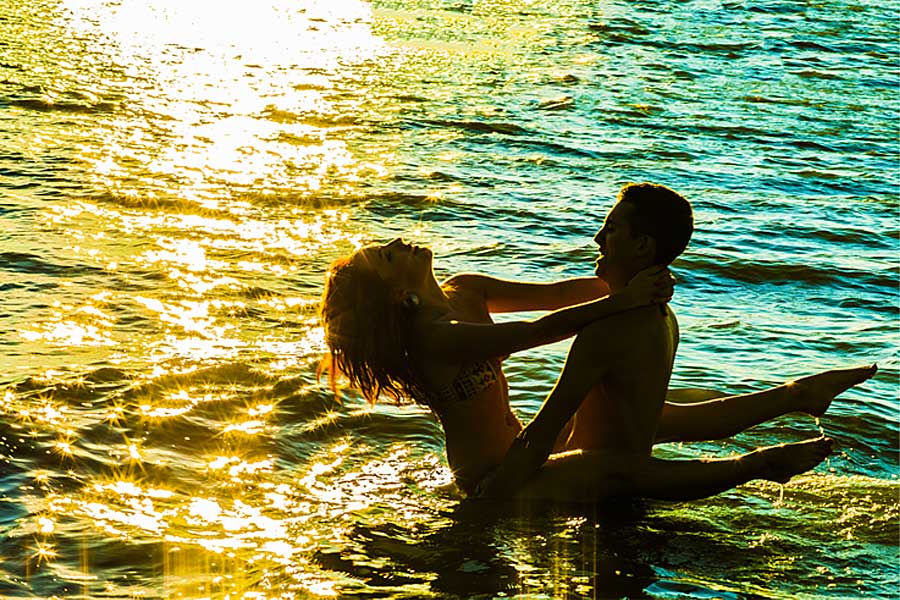 Couple in water embracing, erotic story, Sex On The Beach