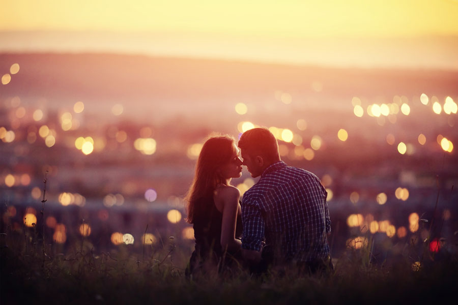 couple kissing in field overlooking city, erotic story