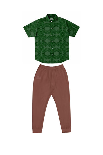 hunter green rose pattern button down shirt paired with light brown slim fit men's joggers for a sharp look for date night.jpg