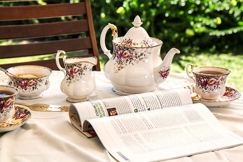 tea set and folded magazine on a table