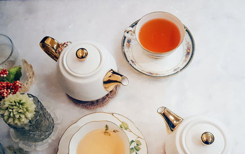 teapots, tea cups, and saucers