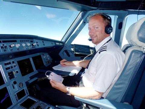 Titan Airways A320 First Officer Oliver Pickstock Holding the Zendure A5 during a Flight.