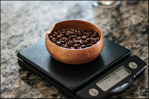 Coffee Beans Getting Weighed On Weighing Scale