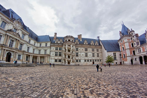 The cobblestone courtyard at Blois castle in the Loire Valley, France