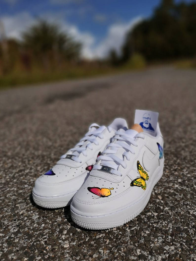 white nike air force 1 with butterflies