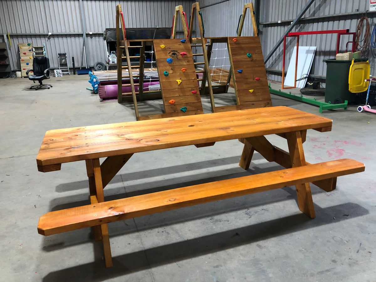 wooden picnic table with attached benches