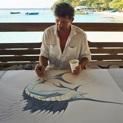 Alex Beard at work in Basil's Bar, Mustique