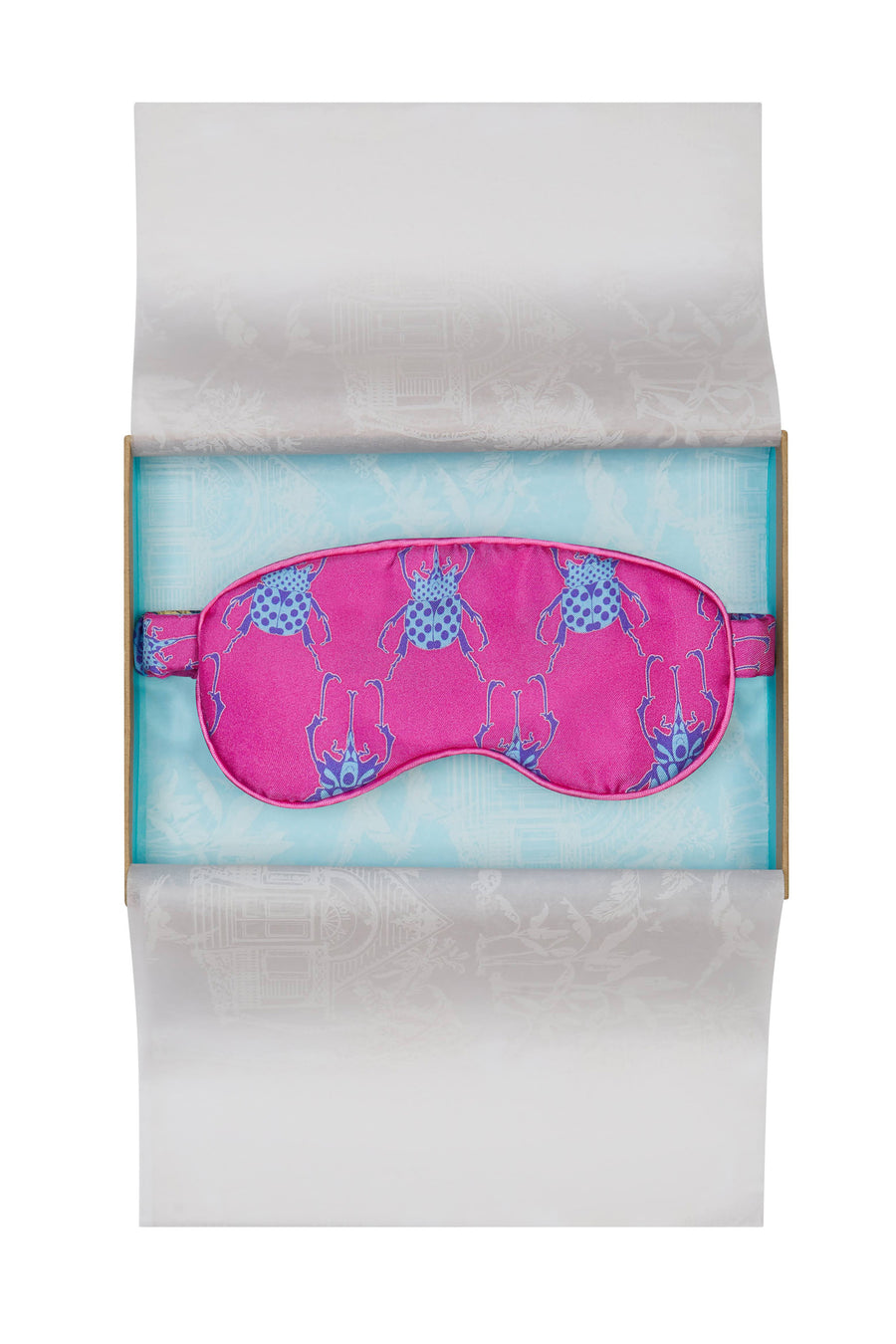 Limited edition pure silk eye mask in bright pink and blue Beetle print by Lotty B Mustique. Handmade in England