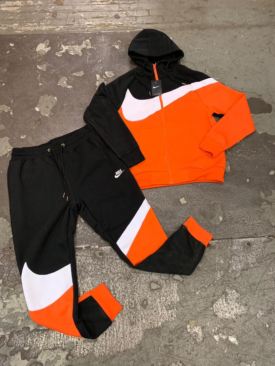 orange nike jogging suit