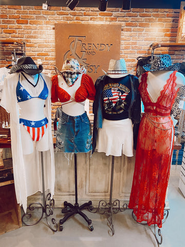 Four mannequins in trendy summer outfits 