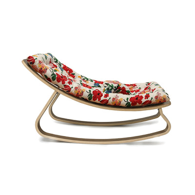 Profile view of Charlie Crane LEVO Baby Rocker in -- Color_Lucas Du Tertre Hibiscus _ Walnut