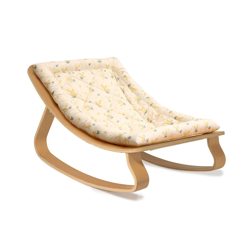 Side view of Charlie Crane LEVO Baby Rocker -- Color_Garbo And Friends Mimosa _ Beech