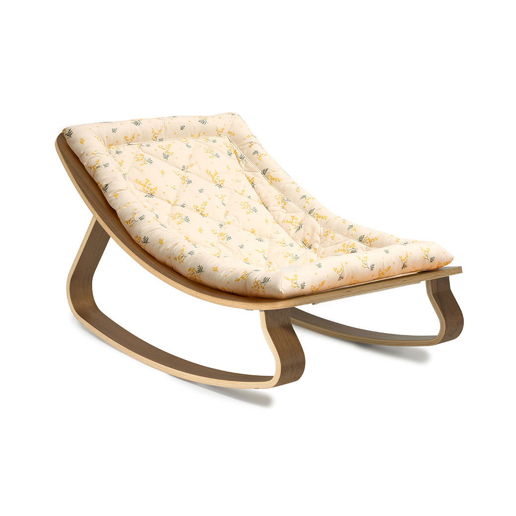 Side view of Charlie Crane LEVO Baby Rocker in -- Color_Garbo And Friends Mimosa _ Walnut