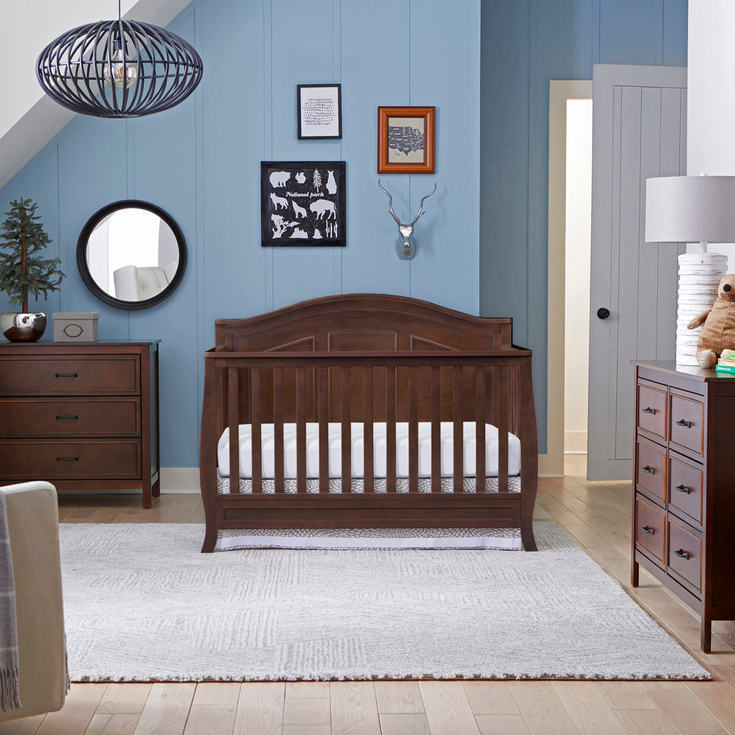 Lifestyle photo of  The DaVinci Charlie 3-Drawer Dresser next to a bed in -- Color_Espresso