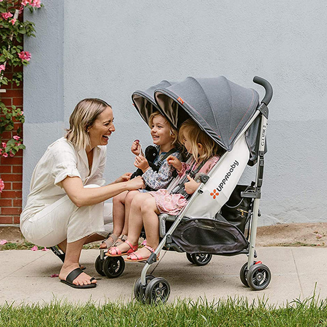 mother talking with two daughters in their troller in -- Lifestyle