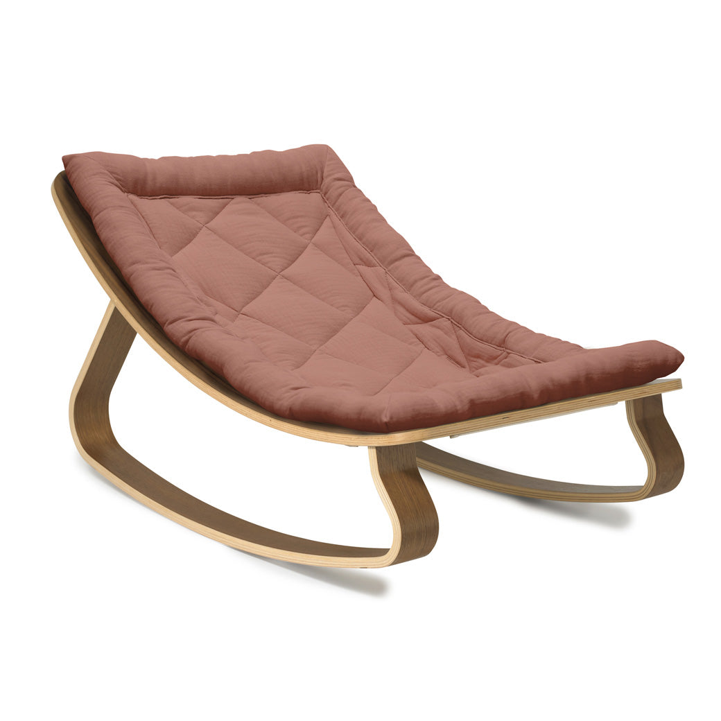 Side view of Charlie Crane LEVO Baby Rocker in -- Color_Bois de Rose _ Walnut