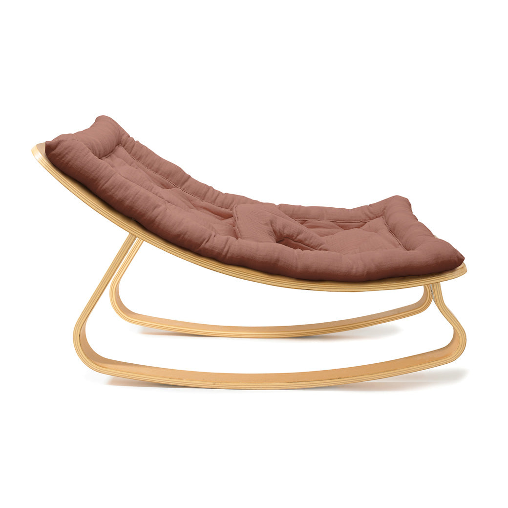 Profile view of Charlie Crane LEVO Baby Rocker in -- Color_Bois de Rose _ Beech