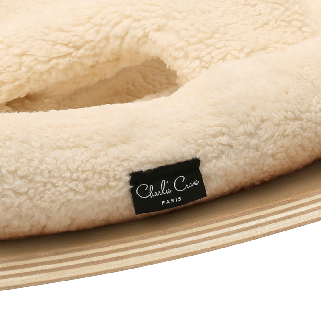 Tags of the Charlie Crane LEVO Baby Rocker in -- Color_Fur Milk _ Beech