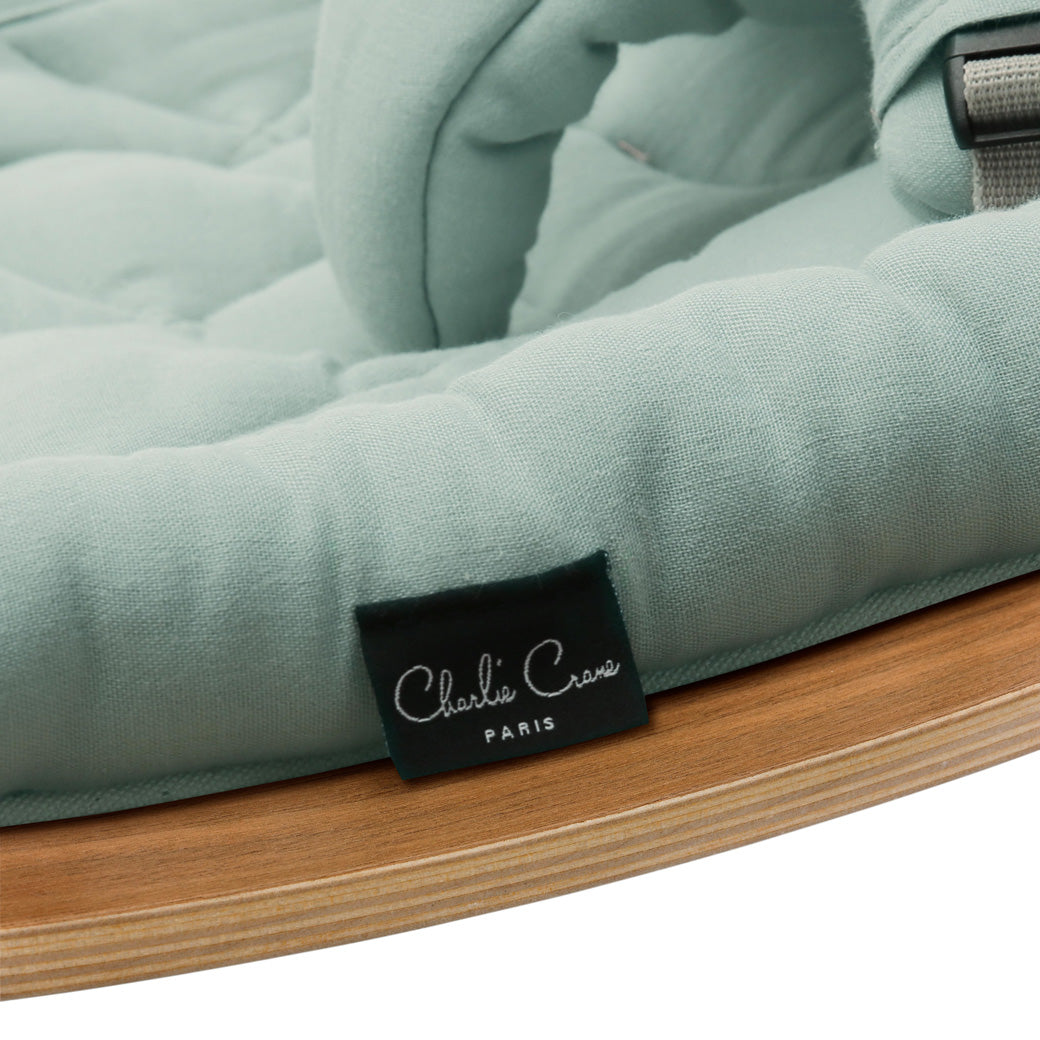 Tags on the Charlie Crane LEVO Baby Rocker in -- Color_Farrow _ Walnut