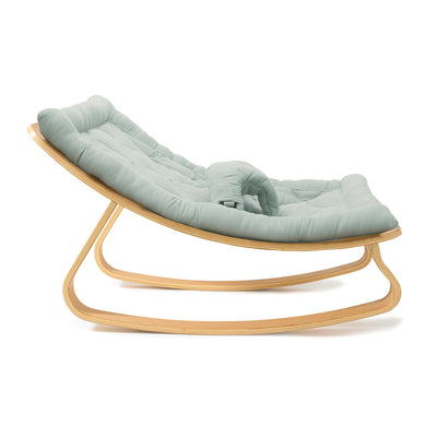 Profile view of Charlie Crane LEVO Baby Rocker in -- Color_Farrow _ Beech