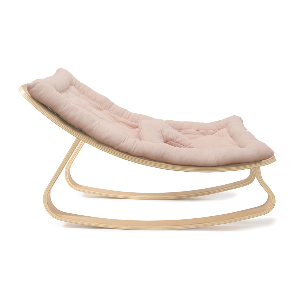 Profile view of Charlie Crane LEVO Baby Rocker in -- Color_Nude _ Beech