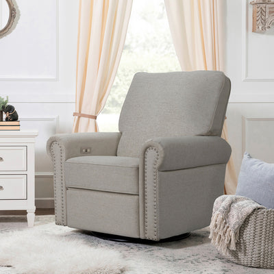 Namesake's Linden Power Swivel Glider Recliner next to a basket and dresser in -- Color_Performance Grey Eco-Weave