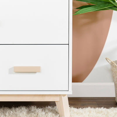 Closeup of the right leg on Babyletto's Scoot 3-Drawer Changer Dresser in -- Color_Washed Natural/White