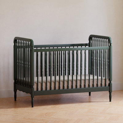 Lifestyle corner view of The Namesake Liberty 3-in-1 Convertible Spindle Crib in -- Color_Forest Green