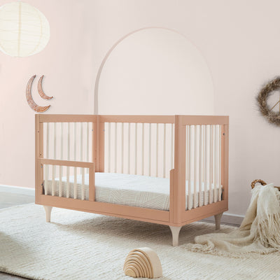 Side view of the Toddler Bed in a room with the Babyletto Lolly 3-in-1 Crib in Canyon
