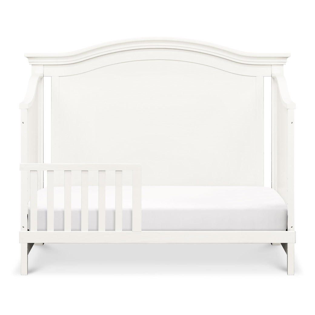 Front view of Namesake's Louis 4-in-1 Convertible Crib as toddler bed  in -- Color_Warm White
