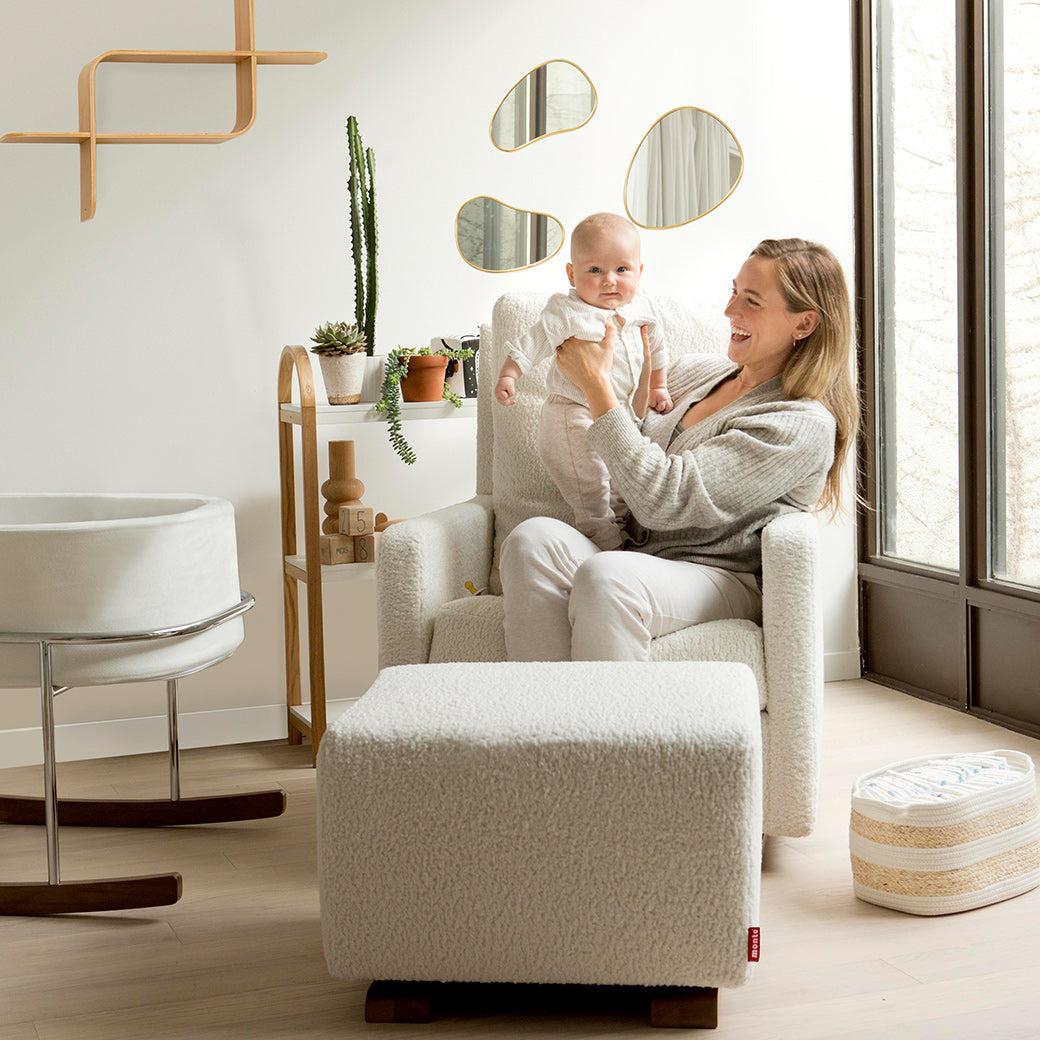 happy woman holding child in glider -- Lifestyle