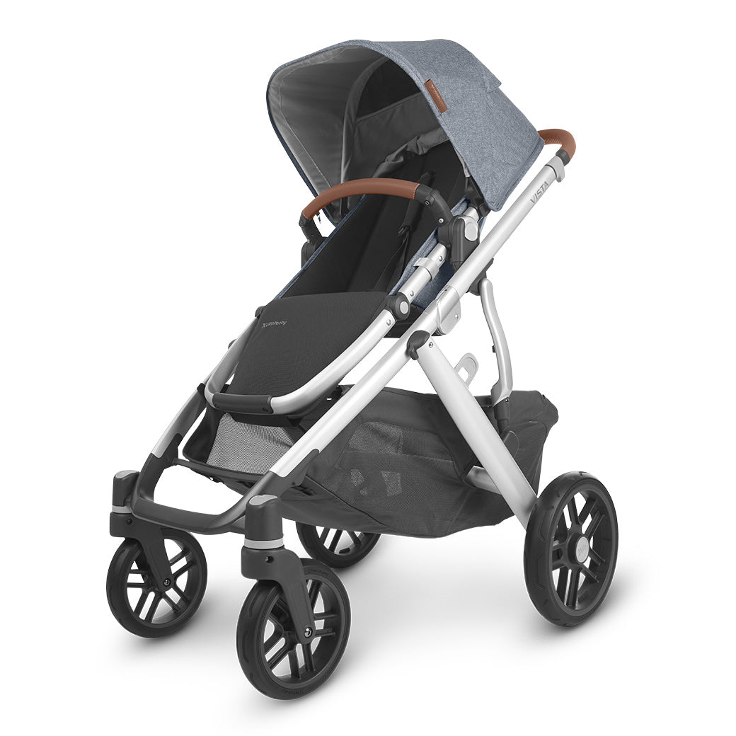 The half extended sunshade on right side view of the uppababy vista v2 stroller -- Color_Gregory