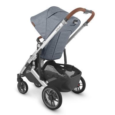 Slightly left rear-facing view of the UPPAbaby CRUZ V2 Stroller in bluish gray and black -- Color_Gregory