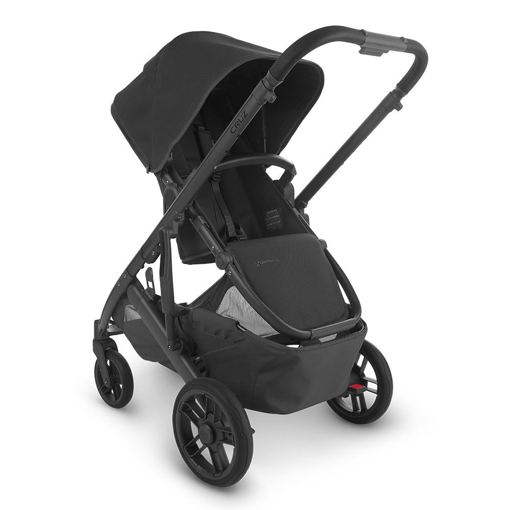 The half extended sunshade on the left side view of uppababy CRUZ V2 stroller -- Color_Jake