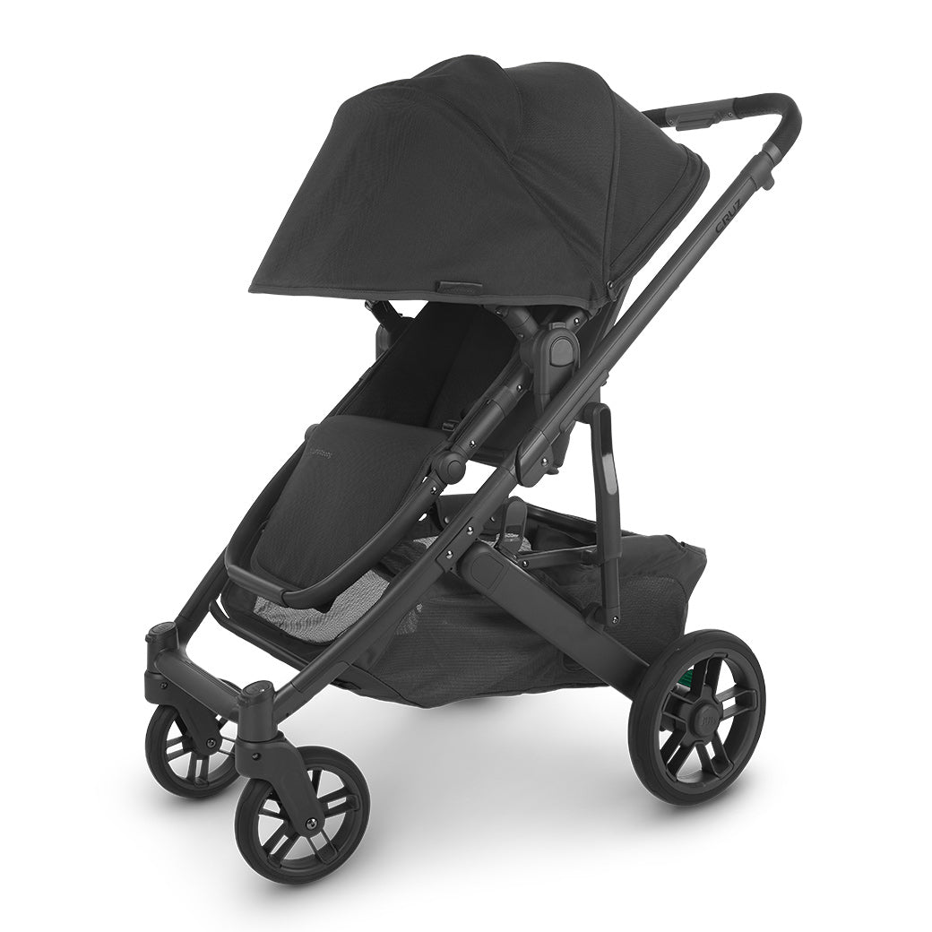 Slightly left-facing view of uppababy cruz v2 stroller front-facing with sun shade fully extended -- Color_Jake