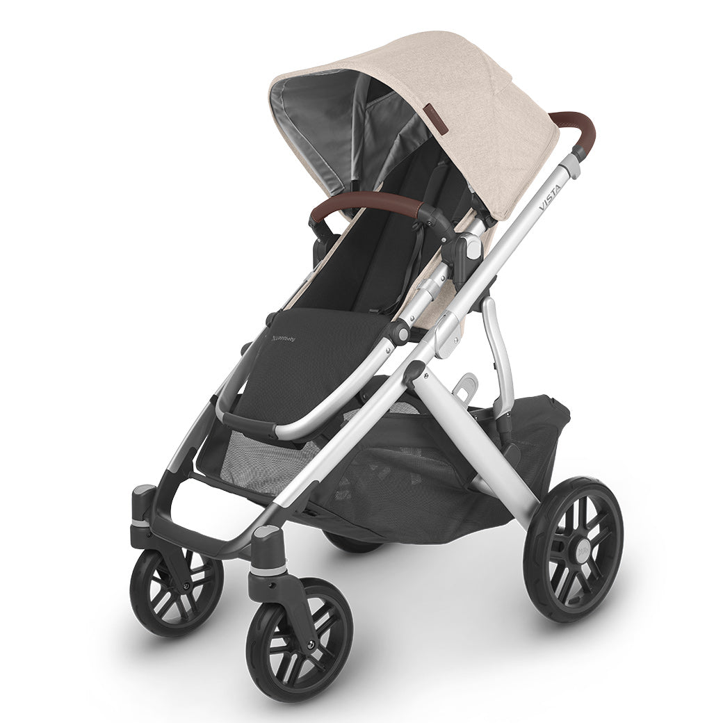 The half extended sunshade on right side view of the uppababy vista v2 stroller -- Color_Declan