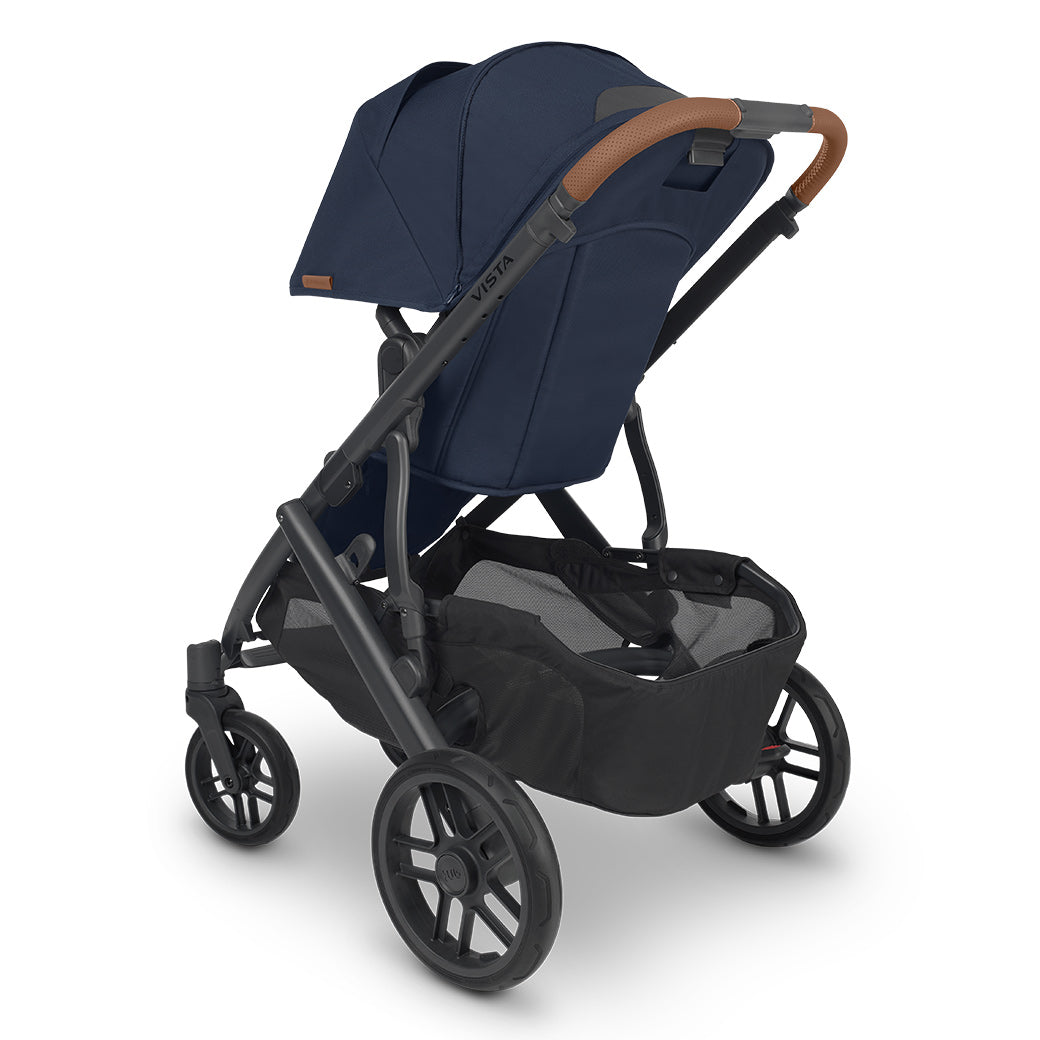 Rear-view of the uppababy vista v2 stroller showing the ample storage basket and leatherette handlebar details -- Color_Noa