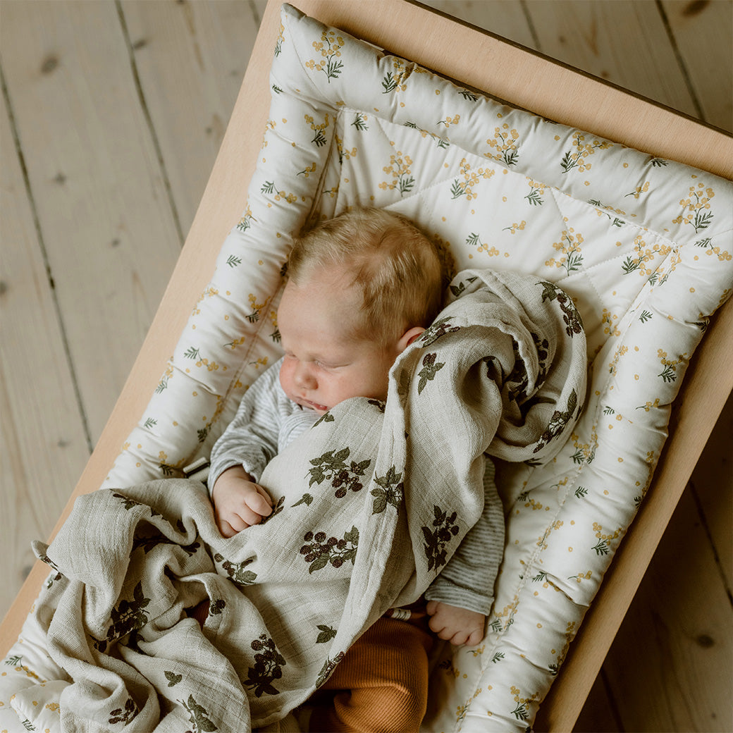 Baby sleeping in the Charlie Crane LEVO Baby Rocker in -- Color_Garbo And Friends Mimosa _ Beech