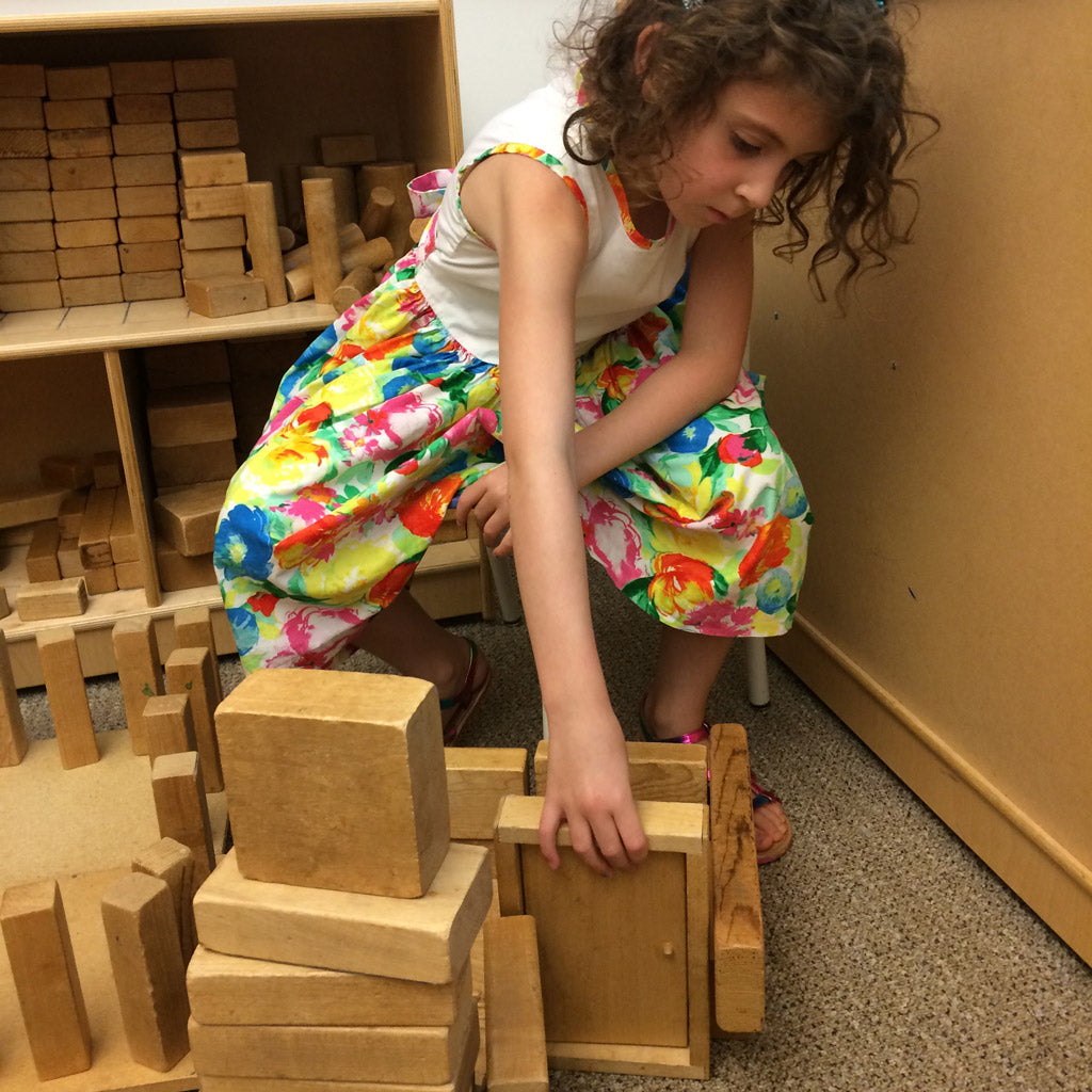 Little Girl Building with blocks