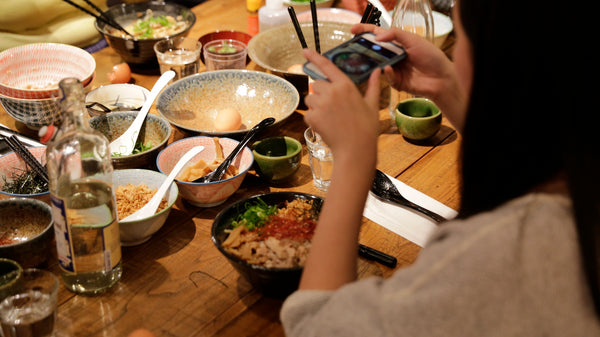 Diner photographing the Abura Soba dish