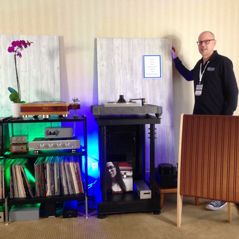 David Stanavich founder or Wax Rax showcases his premier vinyl record storage and turntable stand at the New York Audio Show in New York City.